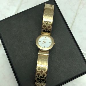 Gold coach watch